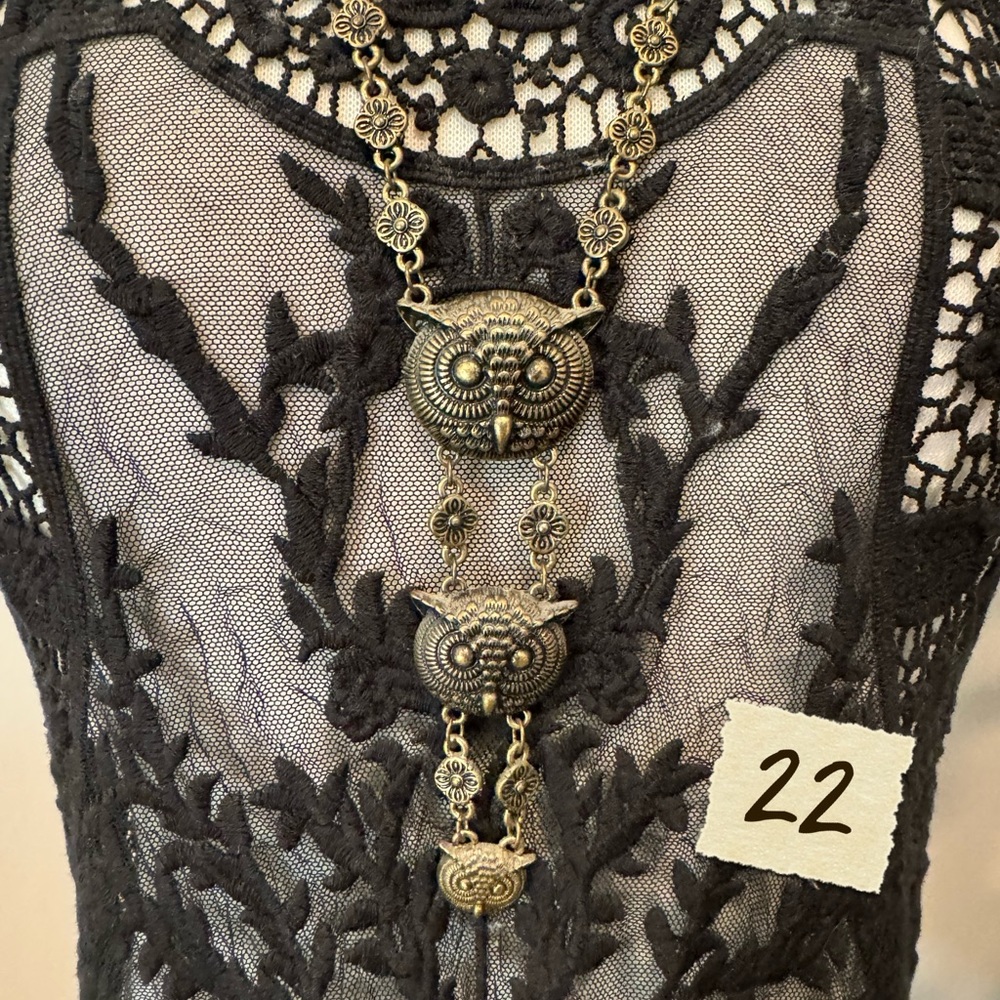 Long owl necklace.